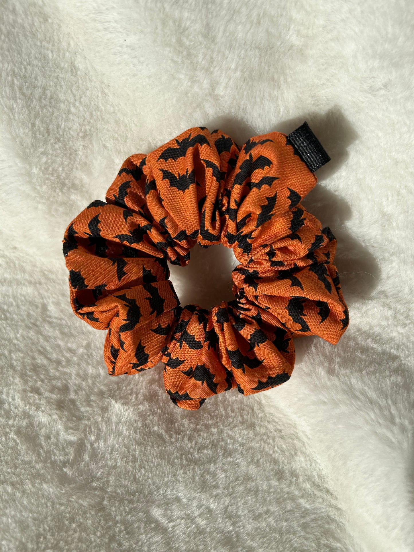 Orange and black bat scrunchie