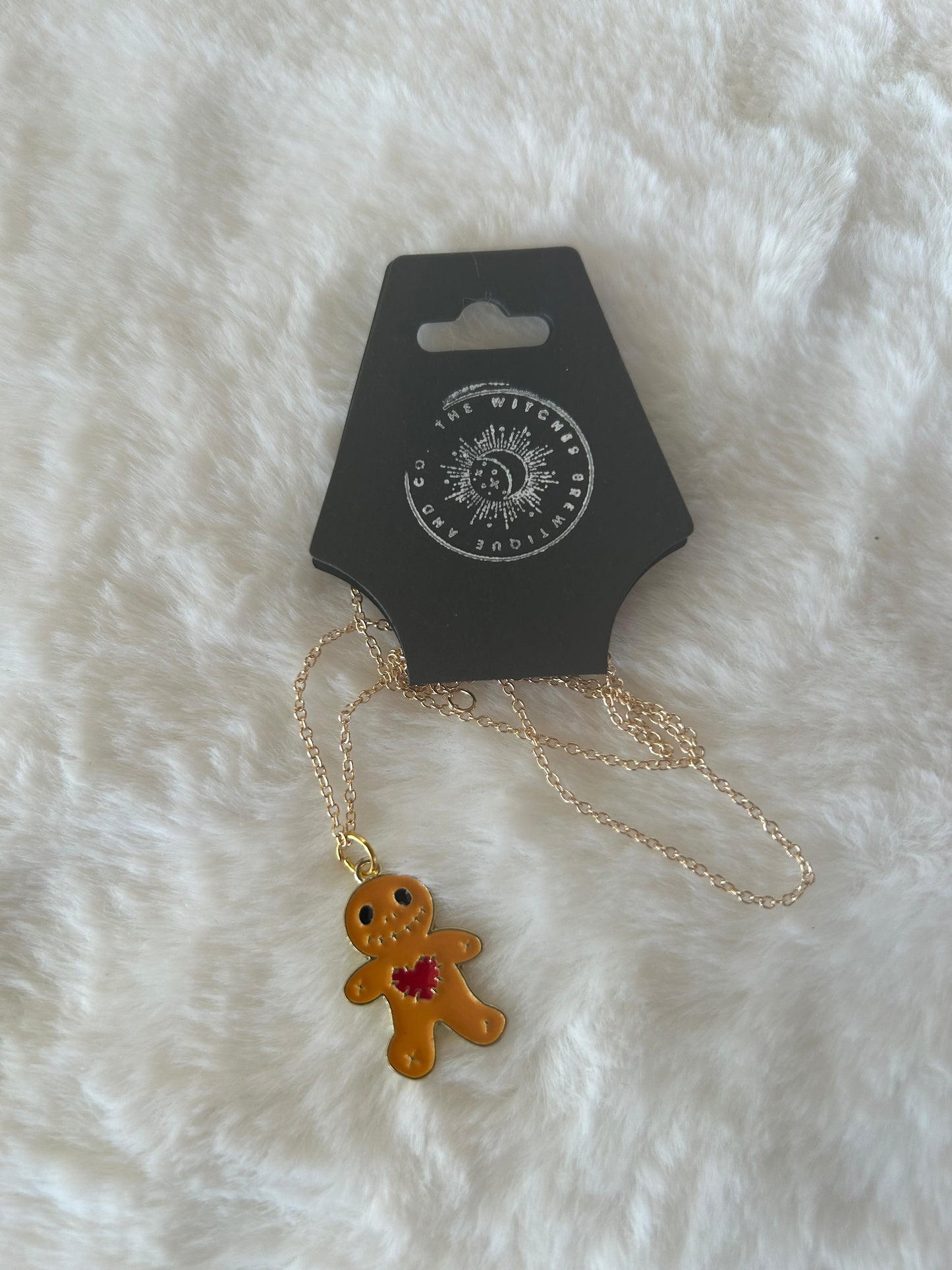 Voodoo doll necklace