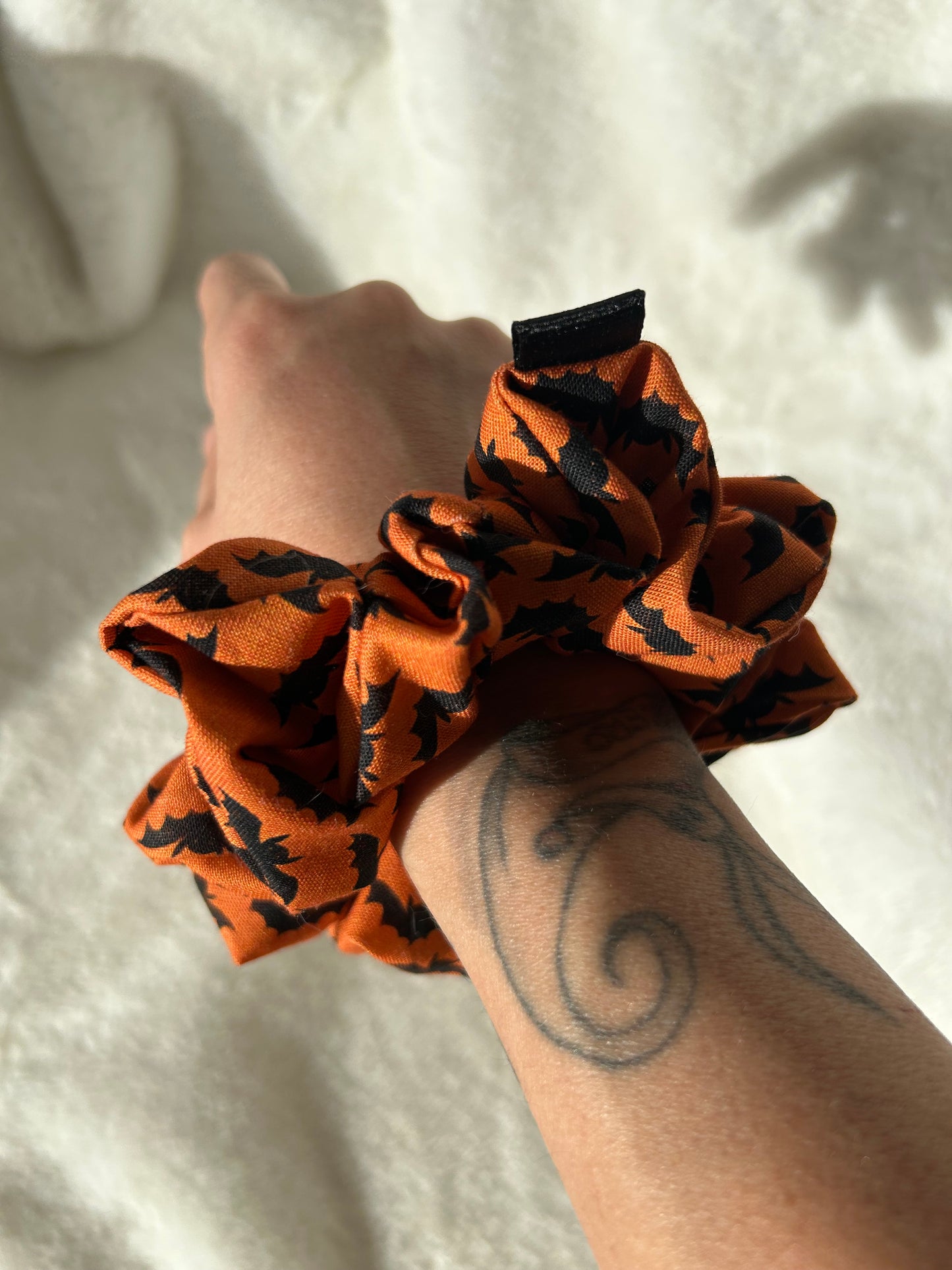 Orange and black bat scrunchie