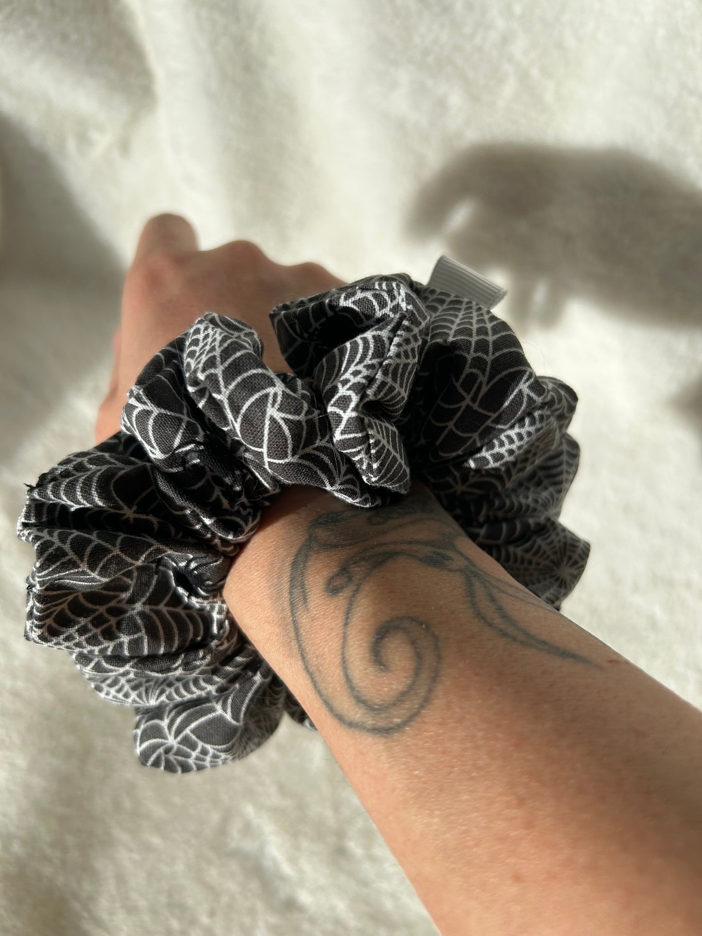 Black and white spiderweb scrunchie