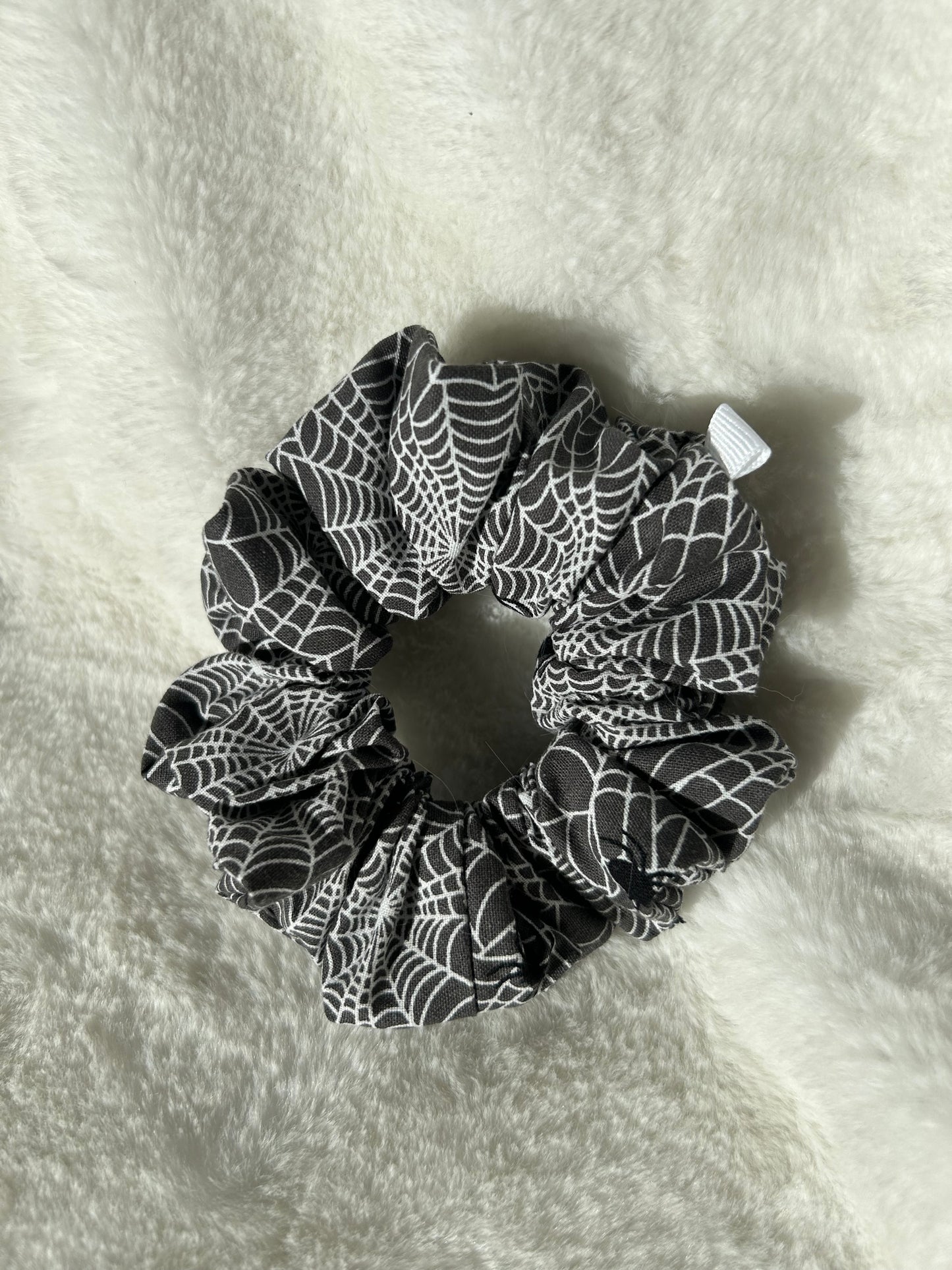 Black and white spiderweb scrunchie