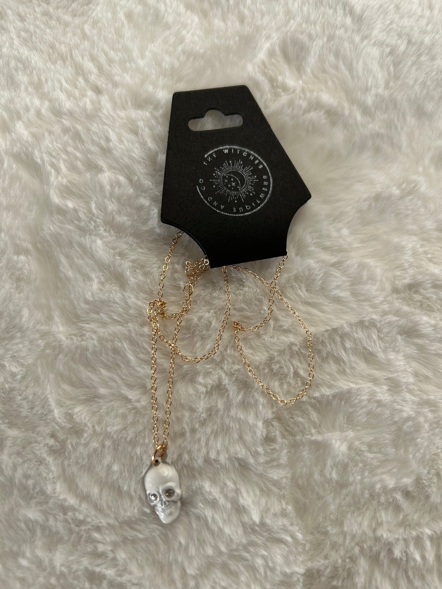 White gem skull necklace