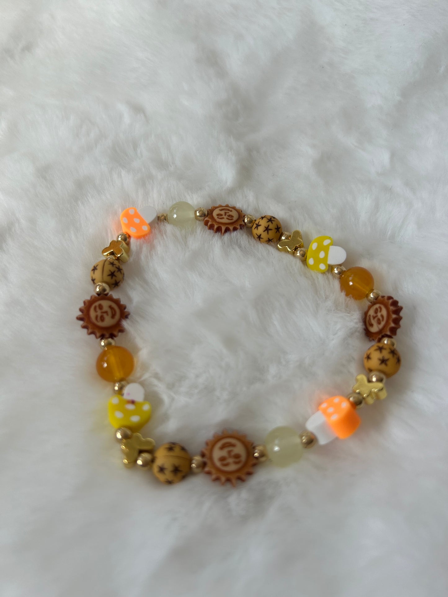 Golden mushrooms and suns bracelet