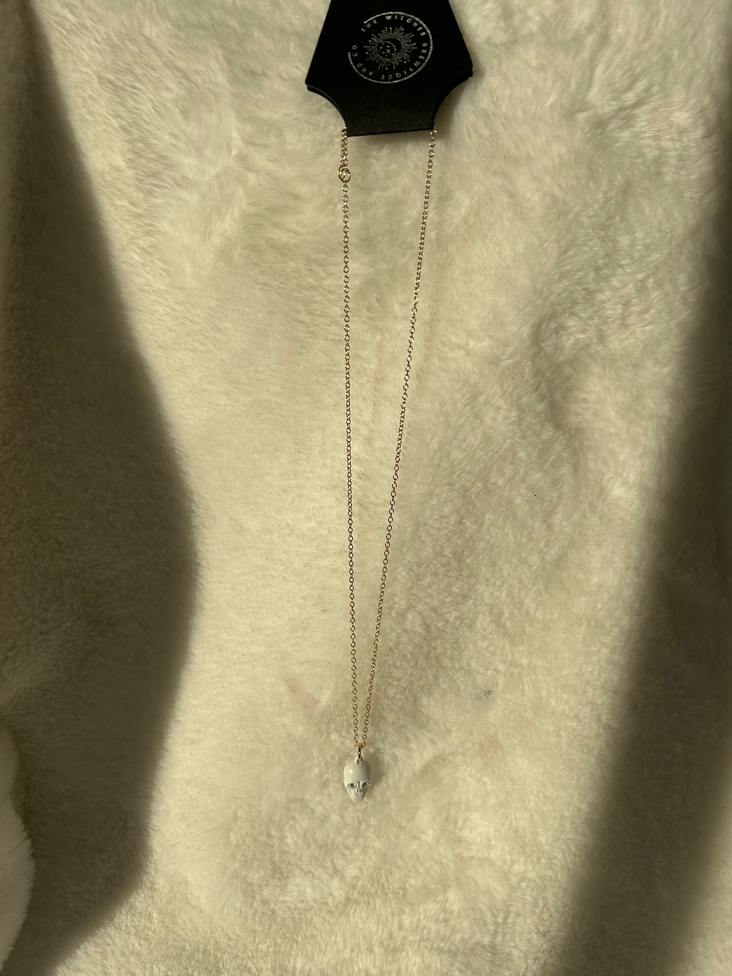 White gem skull necklace