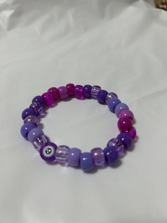 Purple beaded evil eye bracelet