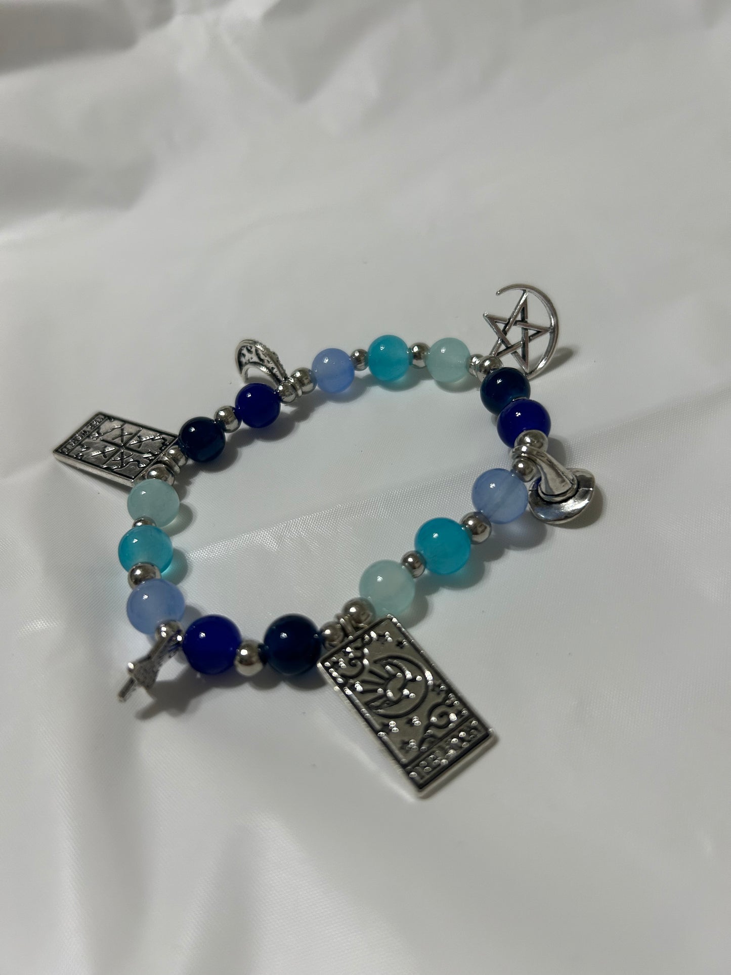 Blue beaded witchy charm bracelet
